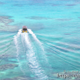 サンゴ礁の海を走るボート-三角点より-