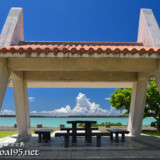 海辺の東家と真夏の入道雲-川満漁港
